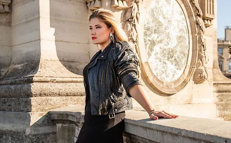 woman-in-black-skirt-and-black-jacket-standing