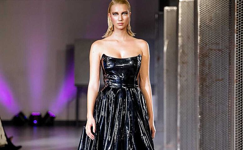 blonde-woman-in-black-gloss-dress