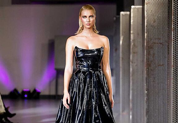 blonde-woman-in-black-gloss-dress