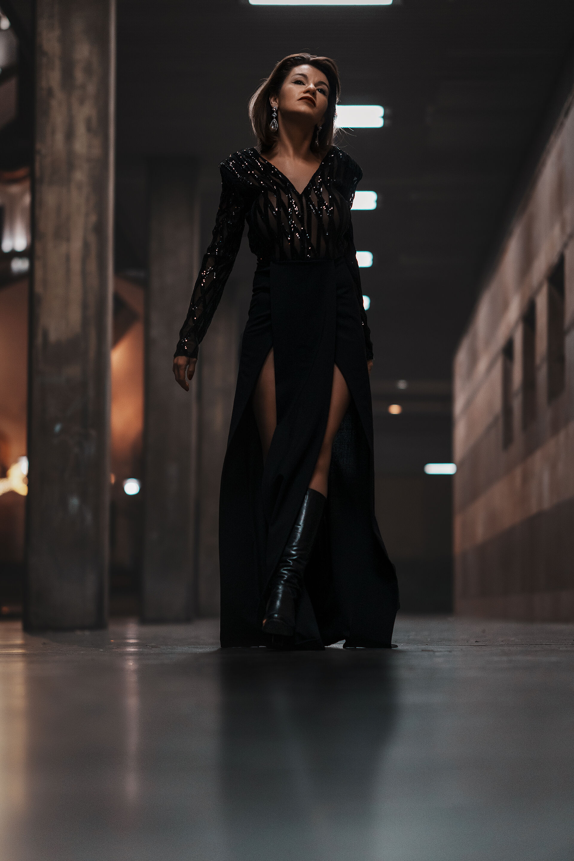 woman-in-black-dress-walking-in-the-dark