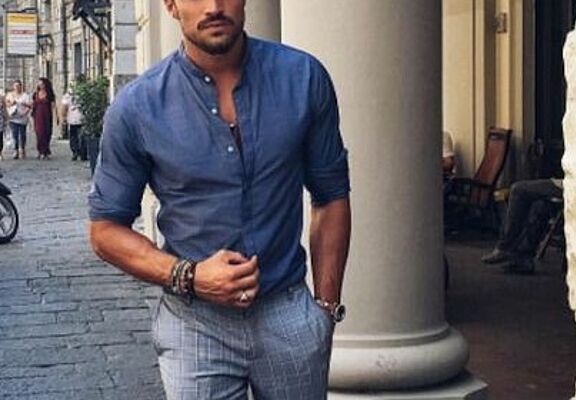 man-in-texas-shirt-russian-collar-and-grey-pants