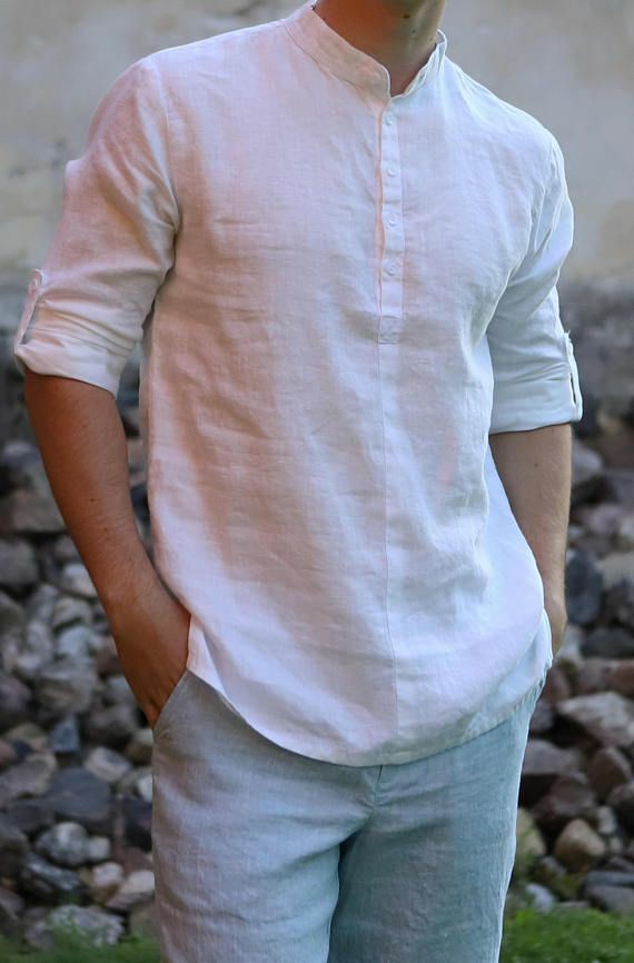 man-in-white-shirt-with-russian-collar-and-grey-pants